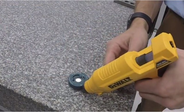 technician demonstrating how to use control points with a glue gun on a table