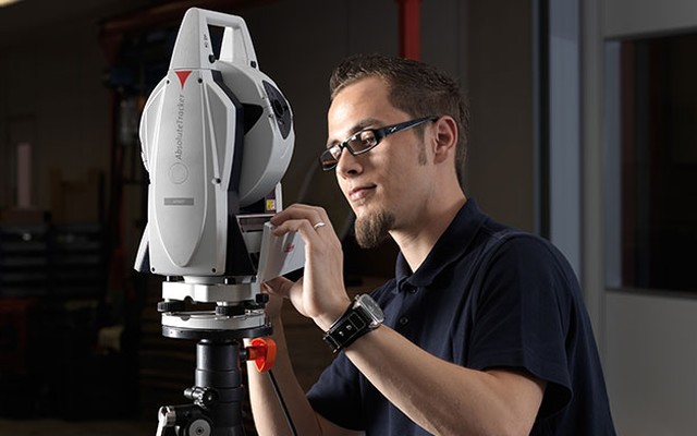 technician maintaining laser tracker