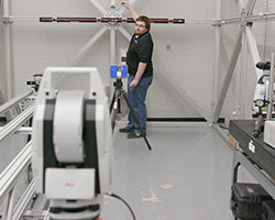 metrology technician calibrating a laser tracker